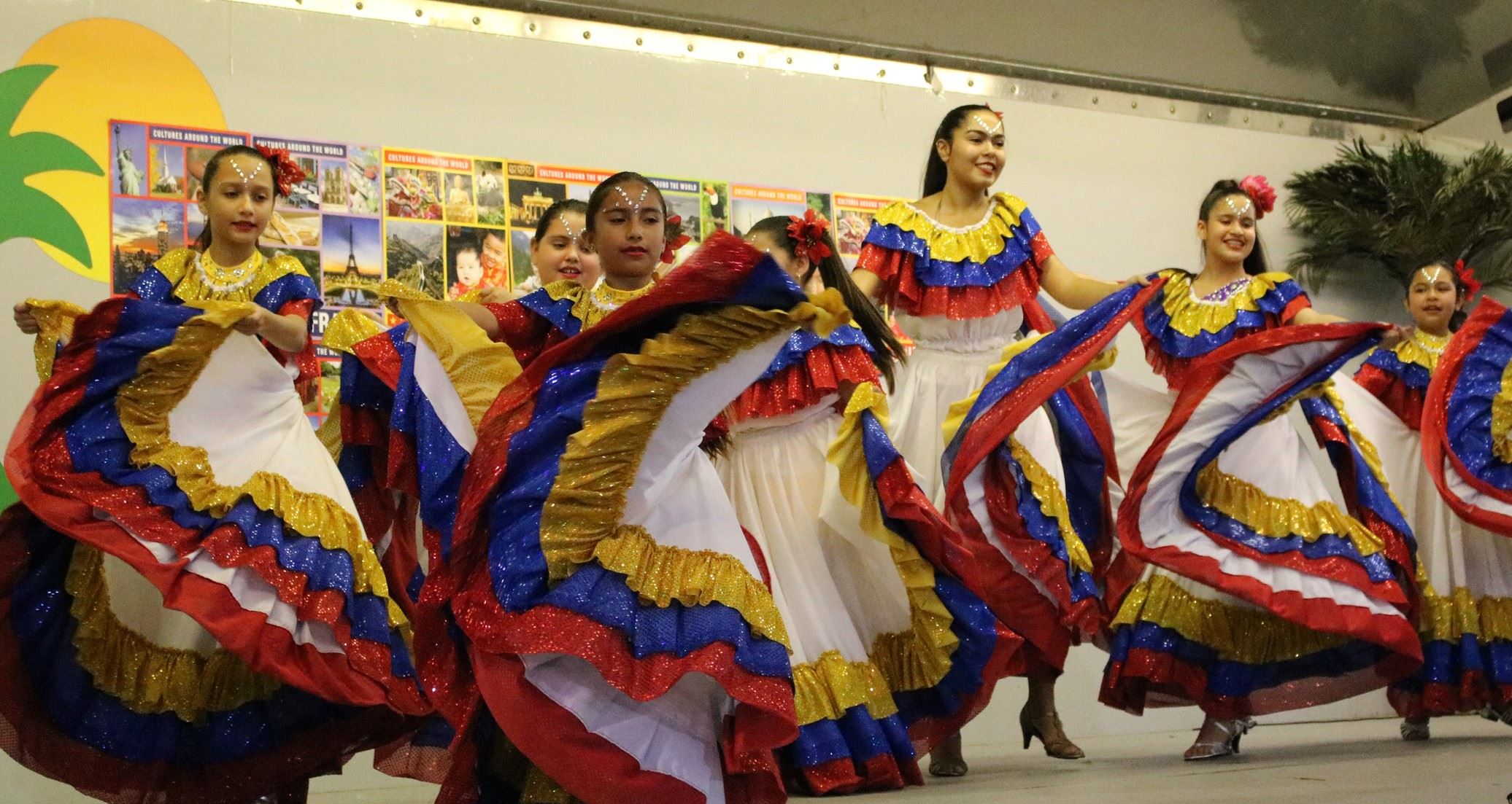 Photos of ladies dancing in colorful costume