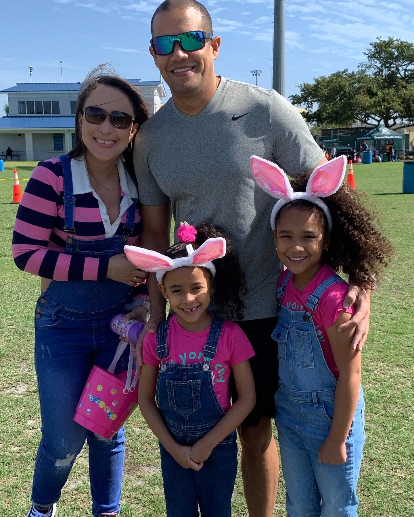 Family of four wearing decorative bunny ears