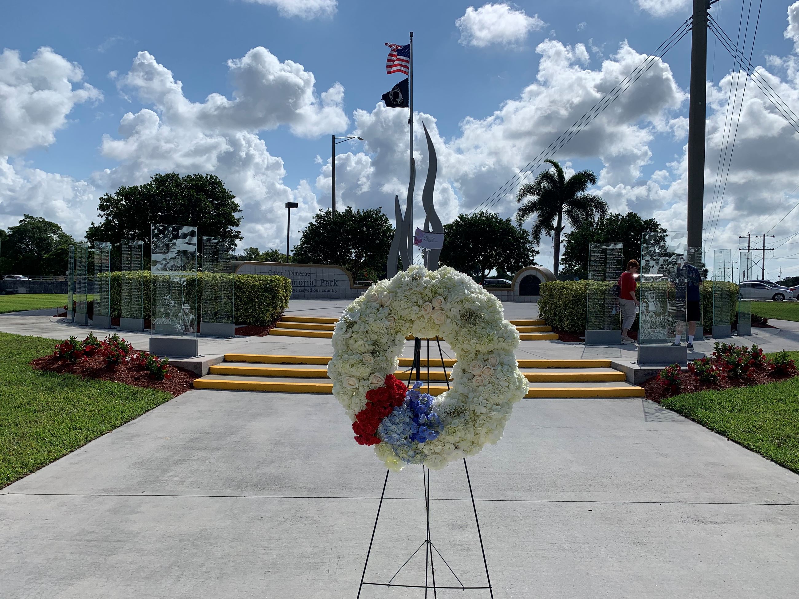 Wreath covered in white, red and blue florals 