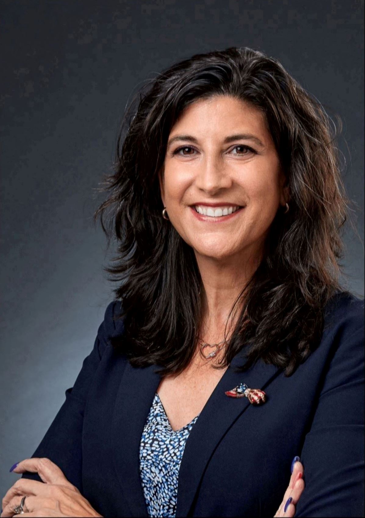 Woman smiling with arms crossed